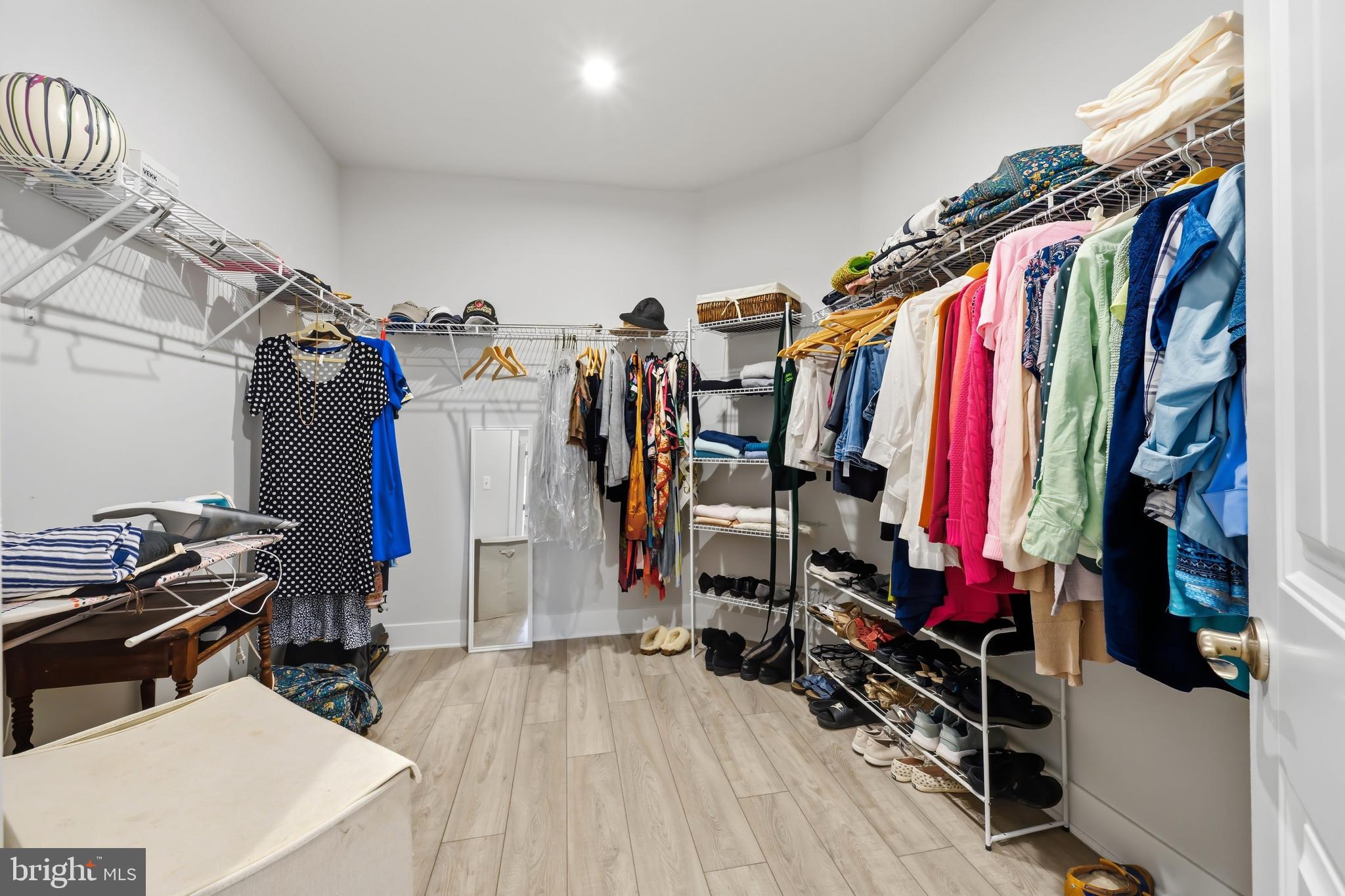 190 Harrier Way, Unit 24 Chester, MD 21619 - Photo 54 of 78 a view of walk in closet with clothes and shoes