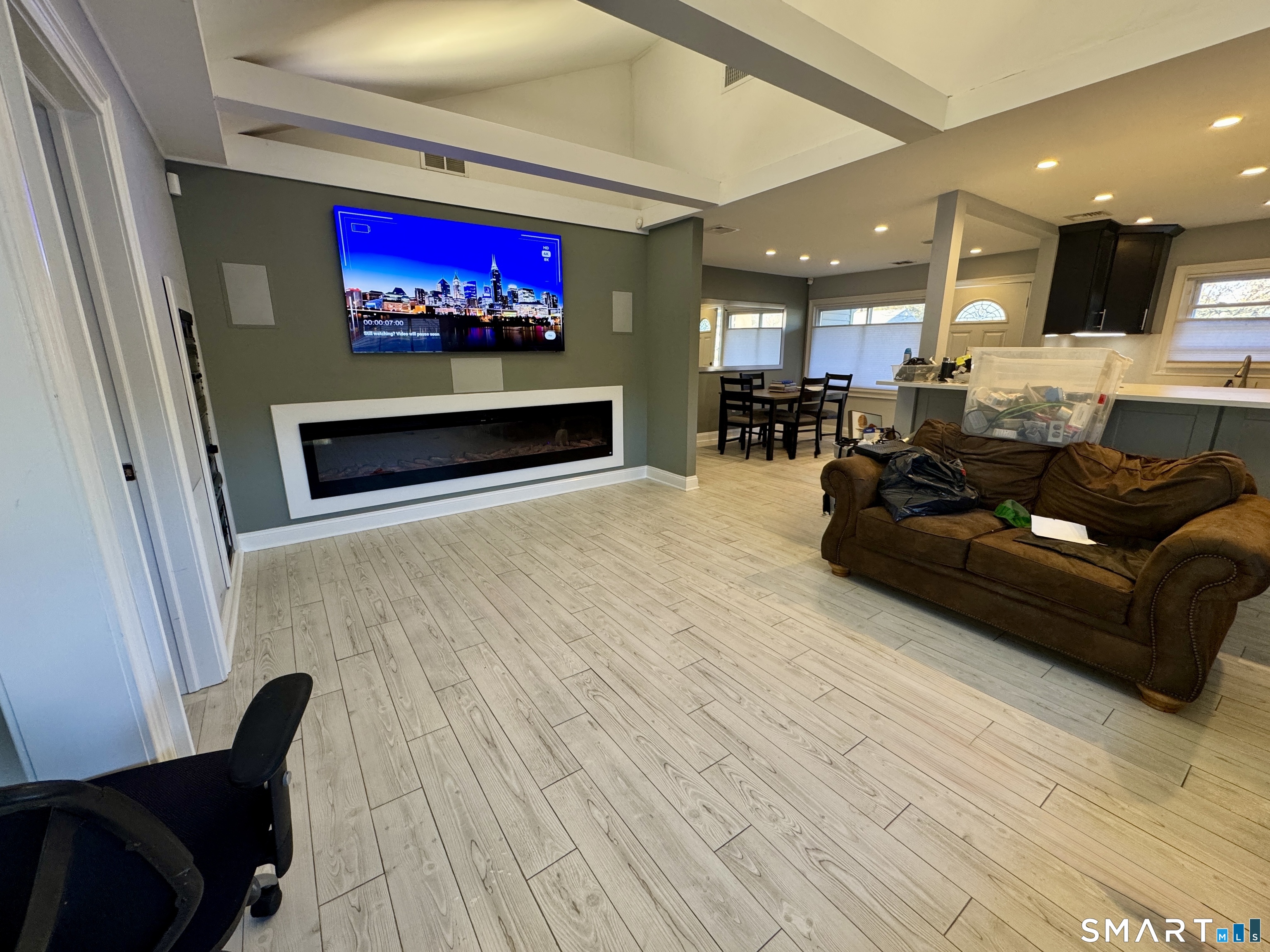 4 Hellstrom Road East Haven, CT 06512 - Photo 13 of 26 a living room with furniture a flat screen tv and a fireplace
