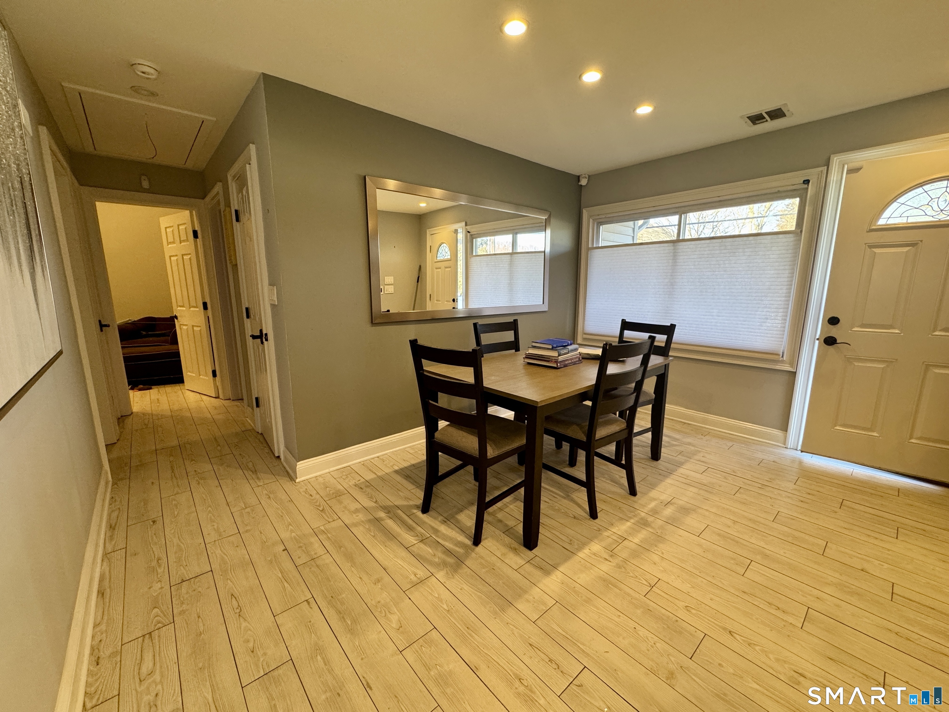 4 Hellstrom Road East Haven, CT 06512 - Photo 16 of 26 a view of a dining room with furniture and wooden floor