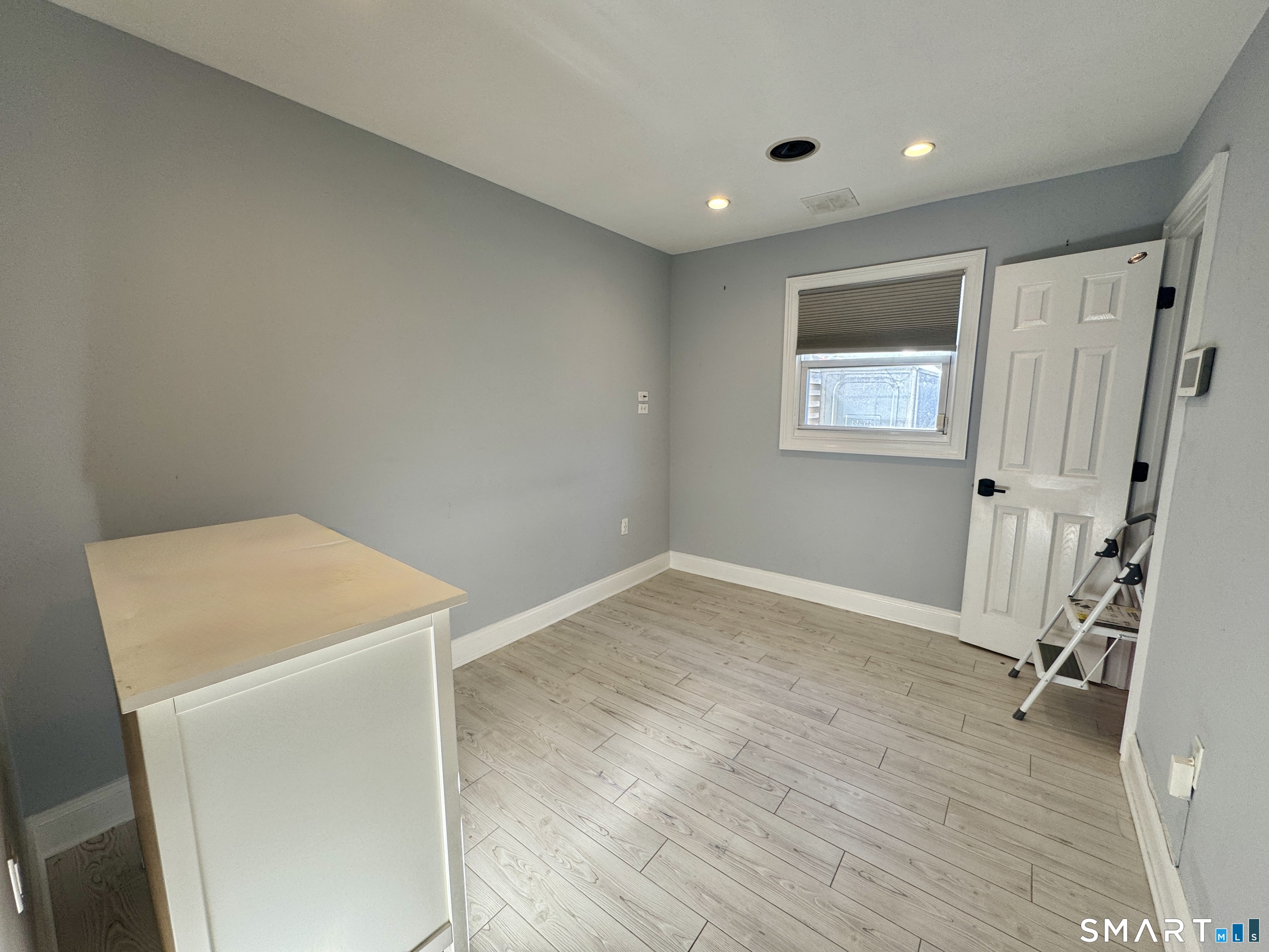 4 Hellstrom Road East Haven, CT 06512 - Photo 22 of 26 a view of room with window and wooden floor