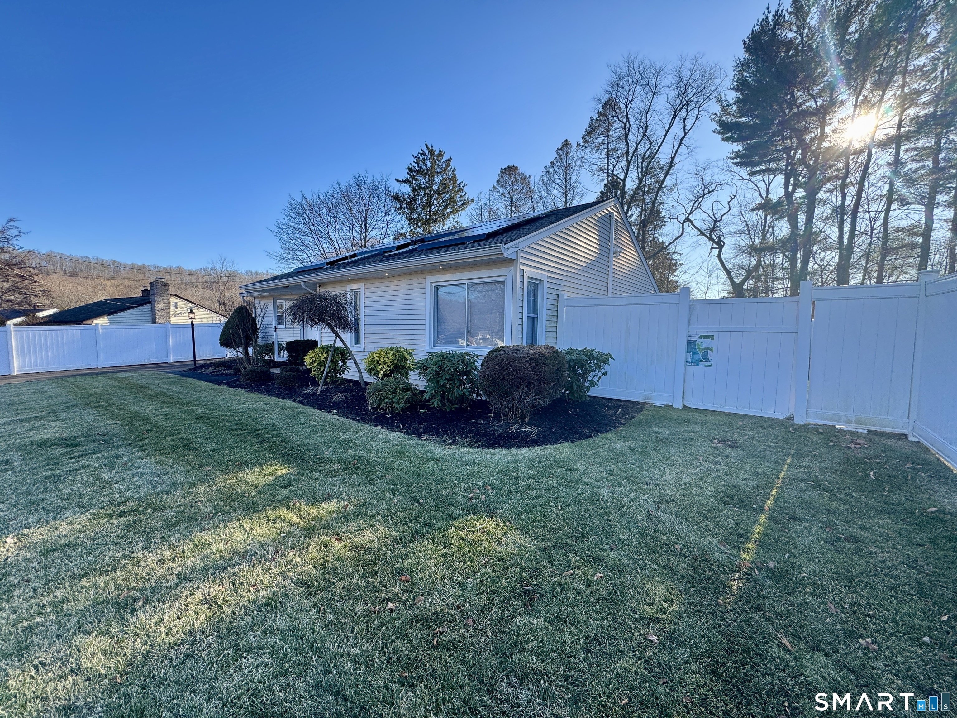 4 Hellstrom Road East Haven, CT 06512 - Photo 9 of 26 a view of a backyard with potted plants and large tree