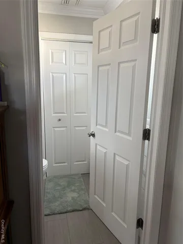 a kitchen with stainless steel appliances granite countertop a stove a sink a dining table and chairs