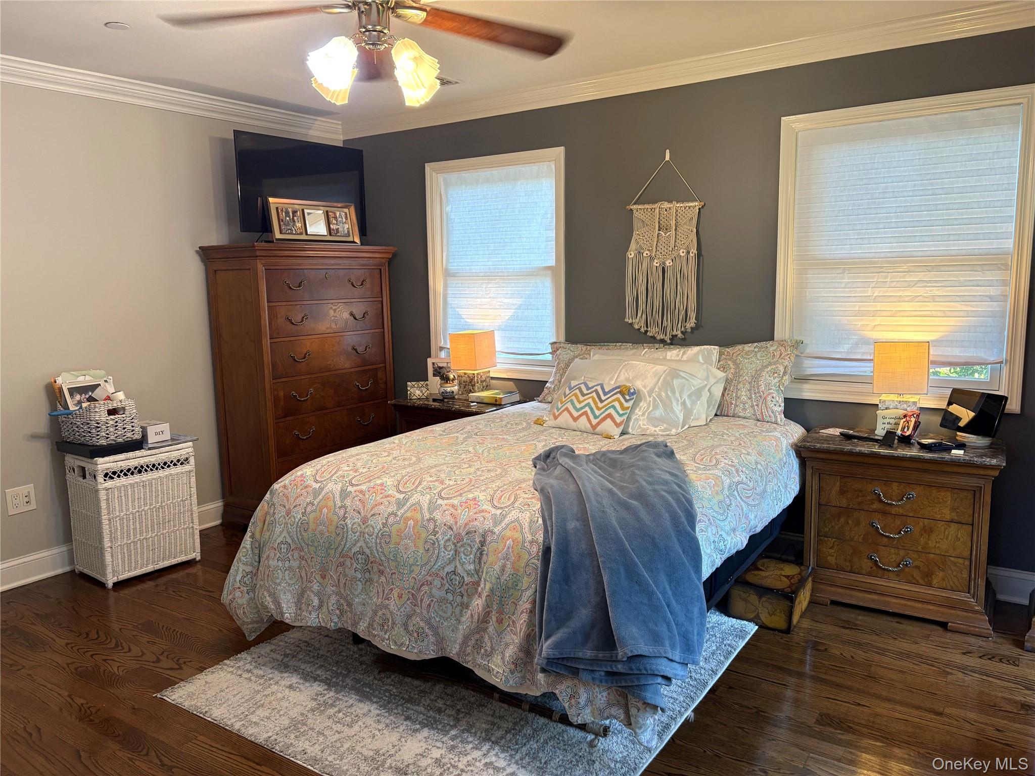 346 South Main Street Freeport, NY 11520 - Photo 14 of 33 Master Bedroom with crown molding, ceiling fan, and dark hardwood floors