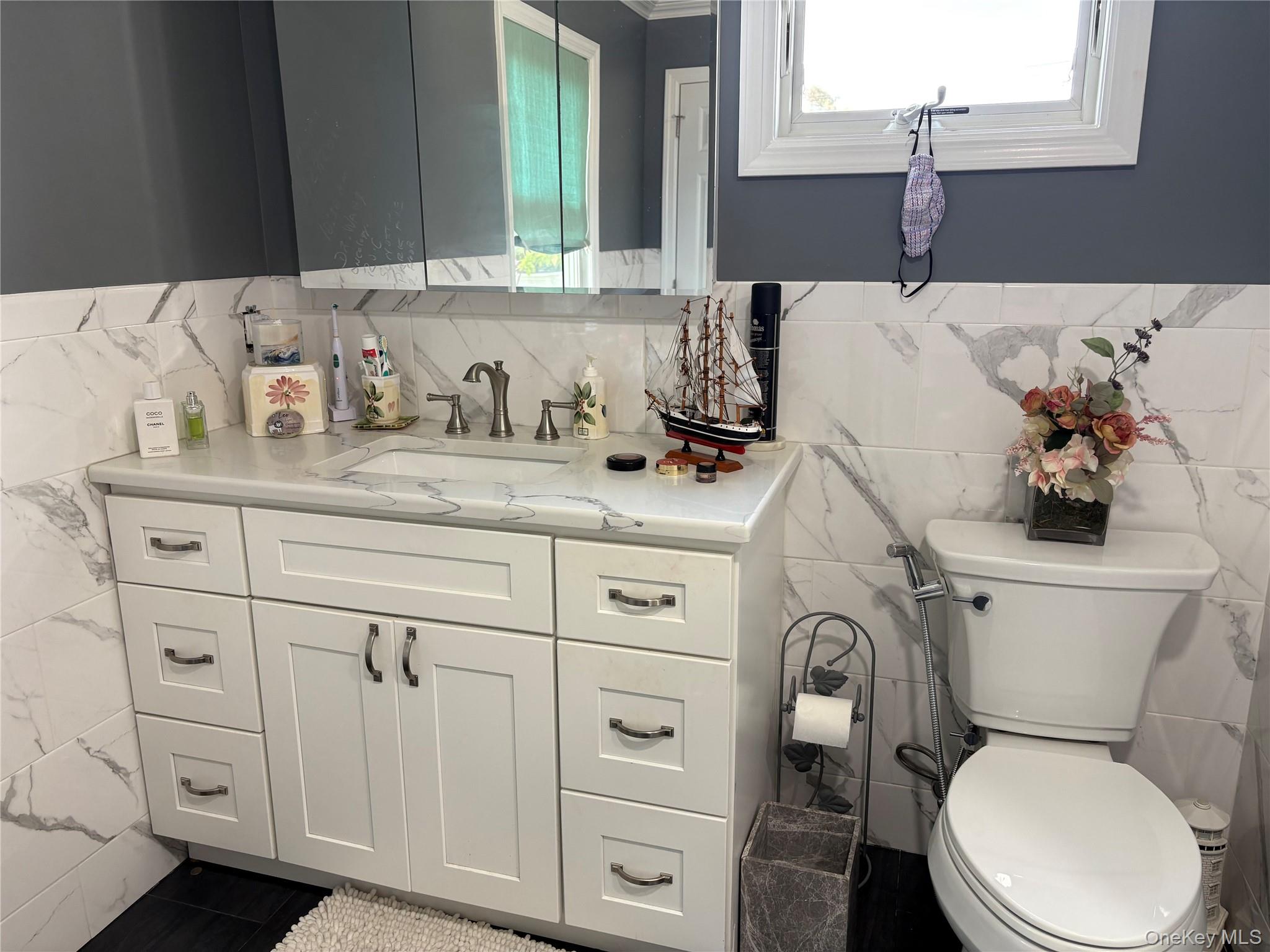 346 South Main Street Freeport, NY 11520 - Photo 17 of 33 a bathroom with a granite countertop toilet sink and mirror