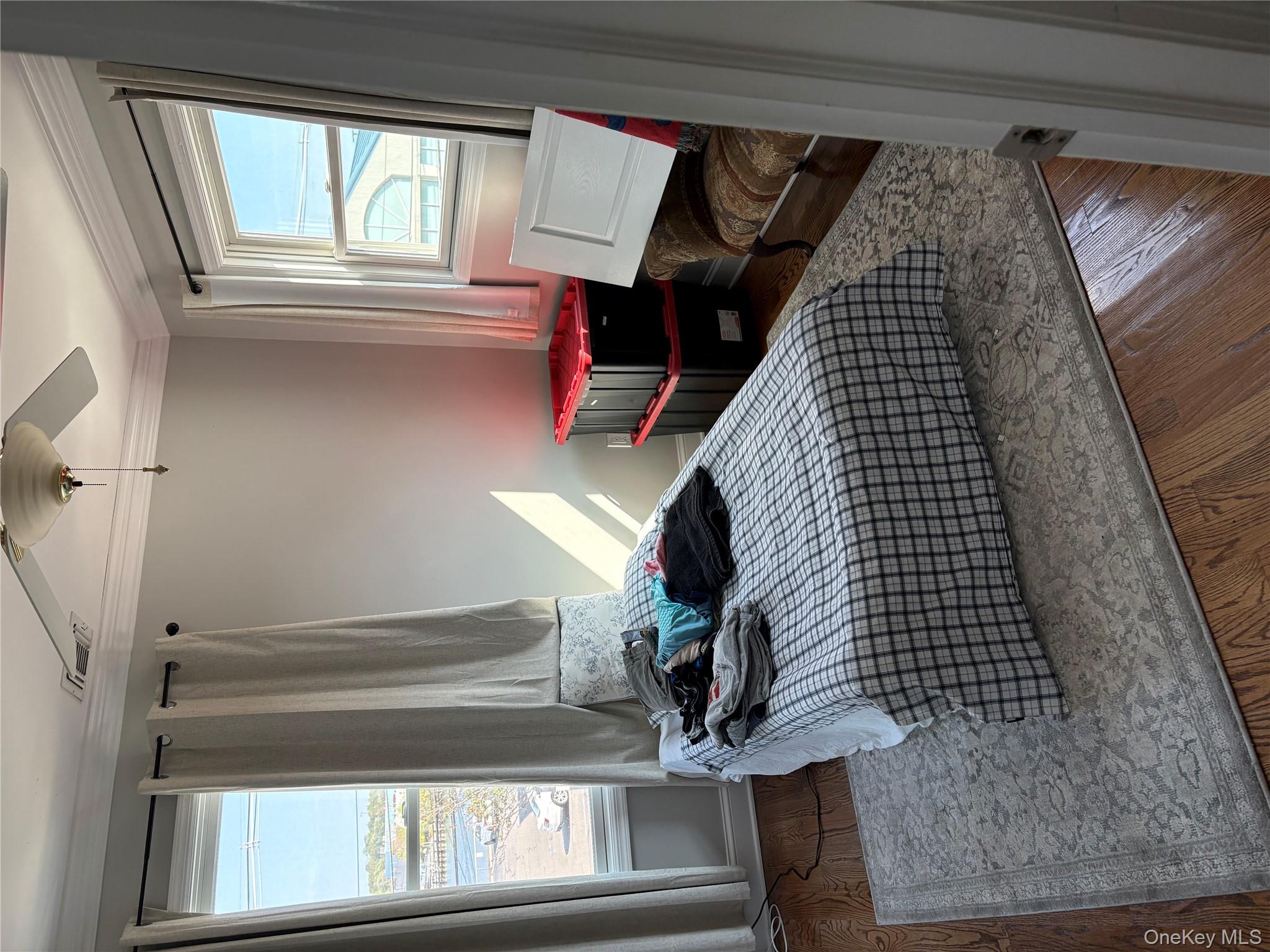 346 South Main Street Freeport, NY 11520 - Photo 19 of 33 a bedroom with a bed and a window