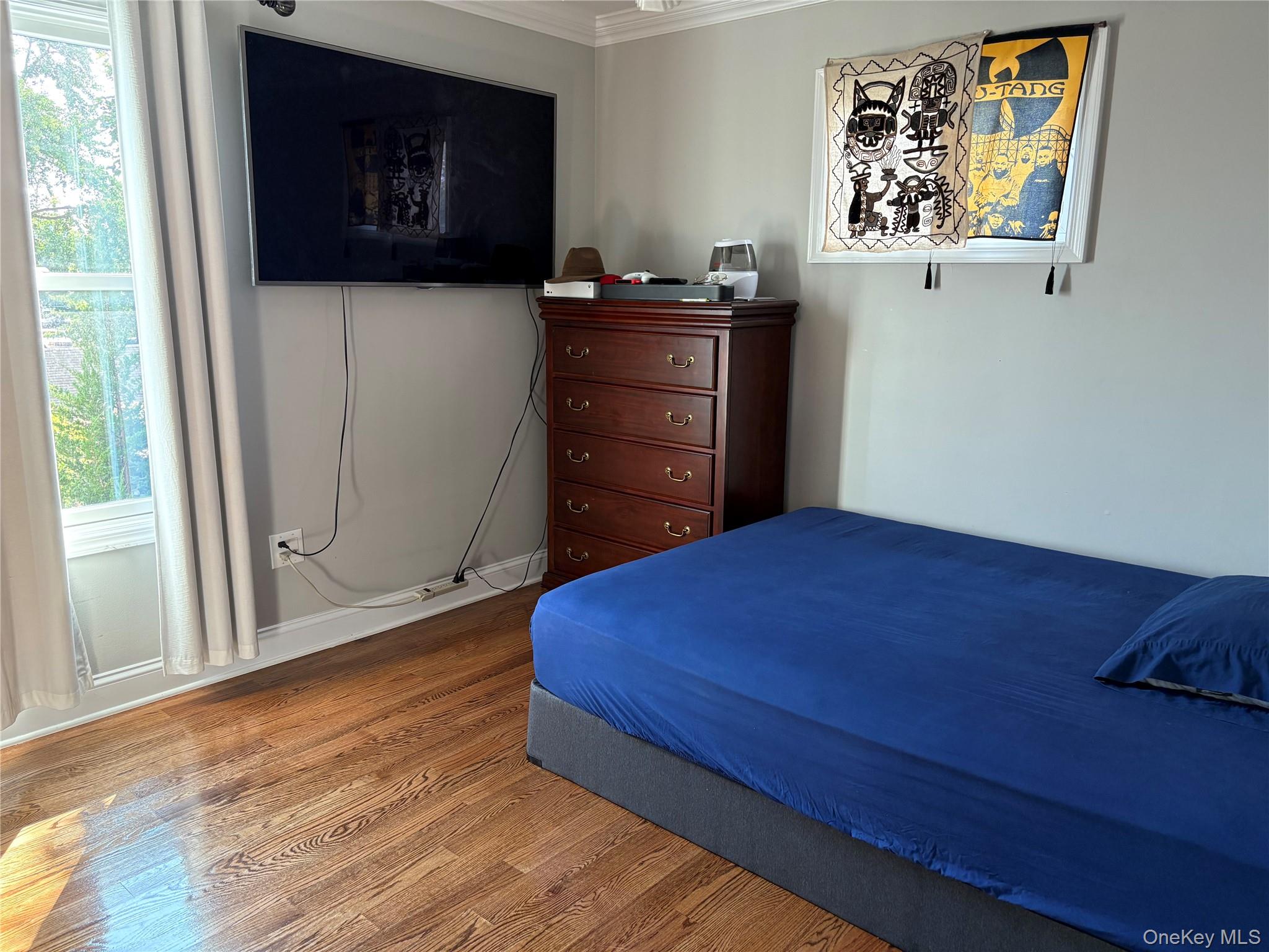 346 South Main Street Freeport, NY 11520 - Photo 21 of 33 a bedroom with a bed and a dresser