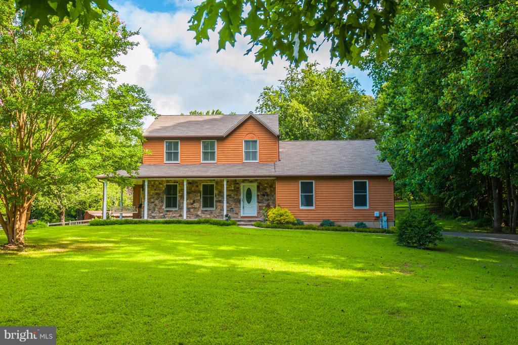 216 Serene Road Friendship, MD 20758 - Photo 1 of 29 a front view of house with yard and green space