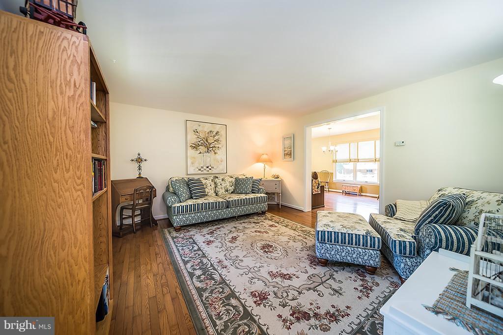 216 Serene Road Friendship, MD 20758 - Photo 12 of 29 a bedroom with furniture and a rug