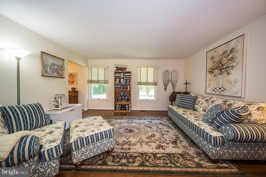 216 Serene Road Friendship, MD 20758 - Photo 13 of 29 a bedroom with a bed and a couch