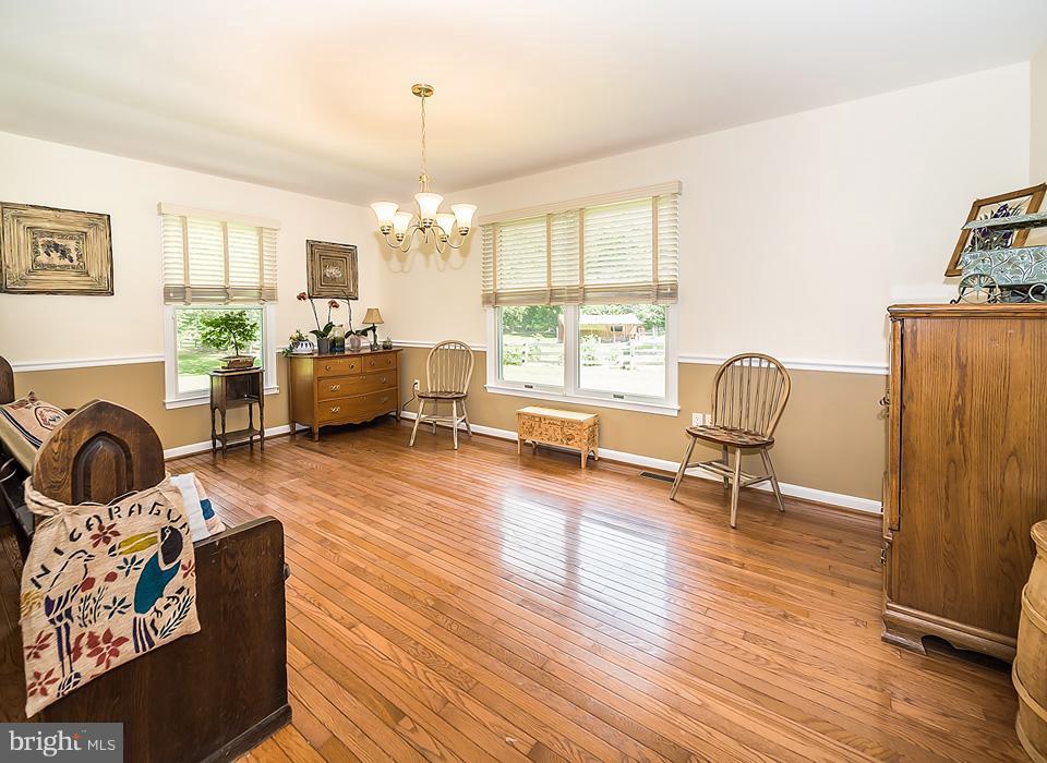216 Serene Road Friendship, MD 20758 - Photo 14 of 29 a living room with furniture or couch and a wooden floor