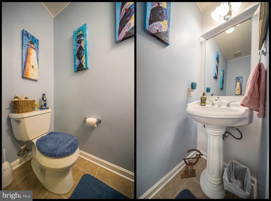 216 Serene Road Friendship, MD 20758 - Photo 18 of 29 a bathroom with a toilet sink and mirror