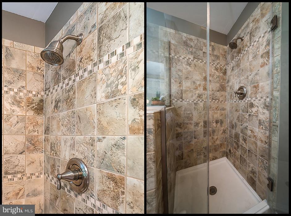 216 Serene Road Friendship, MD 20758 - Photo 20 of 29 a bathroom with a bathtub and shower