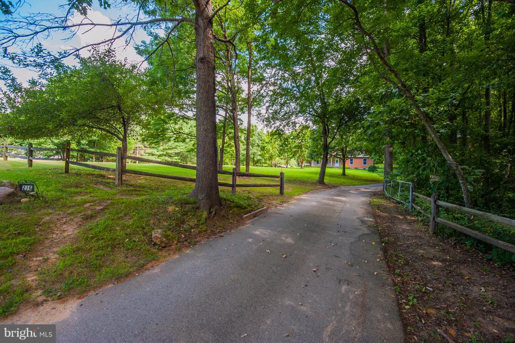 216 Serene Road Friendship, MD 20758 - Photo 3 of 29 a view of a park with large trees