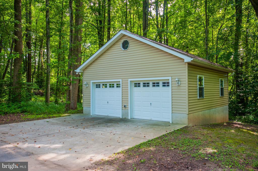 216 Serene Road Friendship, MD 20758 - Photo 5 of 29 a view of a backyard of the house