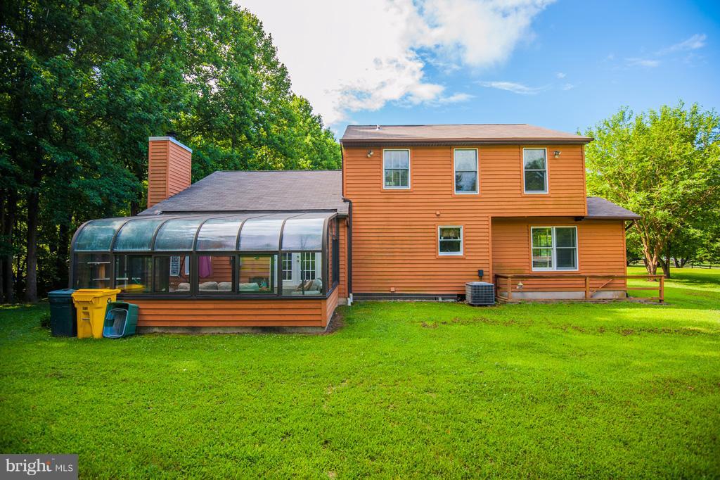 216 Serene Road Friendship, MD 20758 - Photo 6 of 29 a front view of a house with garden