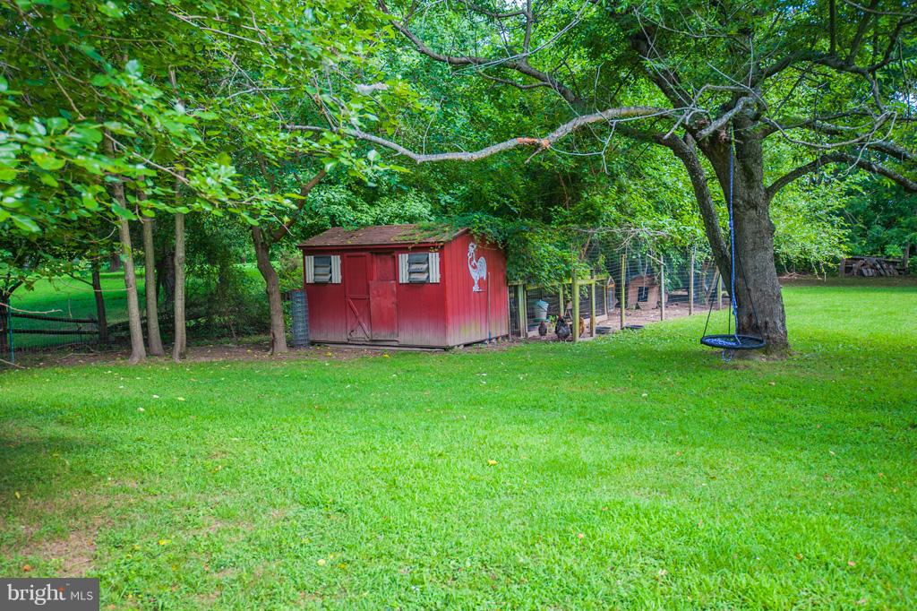 216 Serene Road Friendship, MD 20758 - Photo 7 of 29 a view of outdoor space with deck and yard
