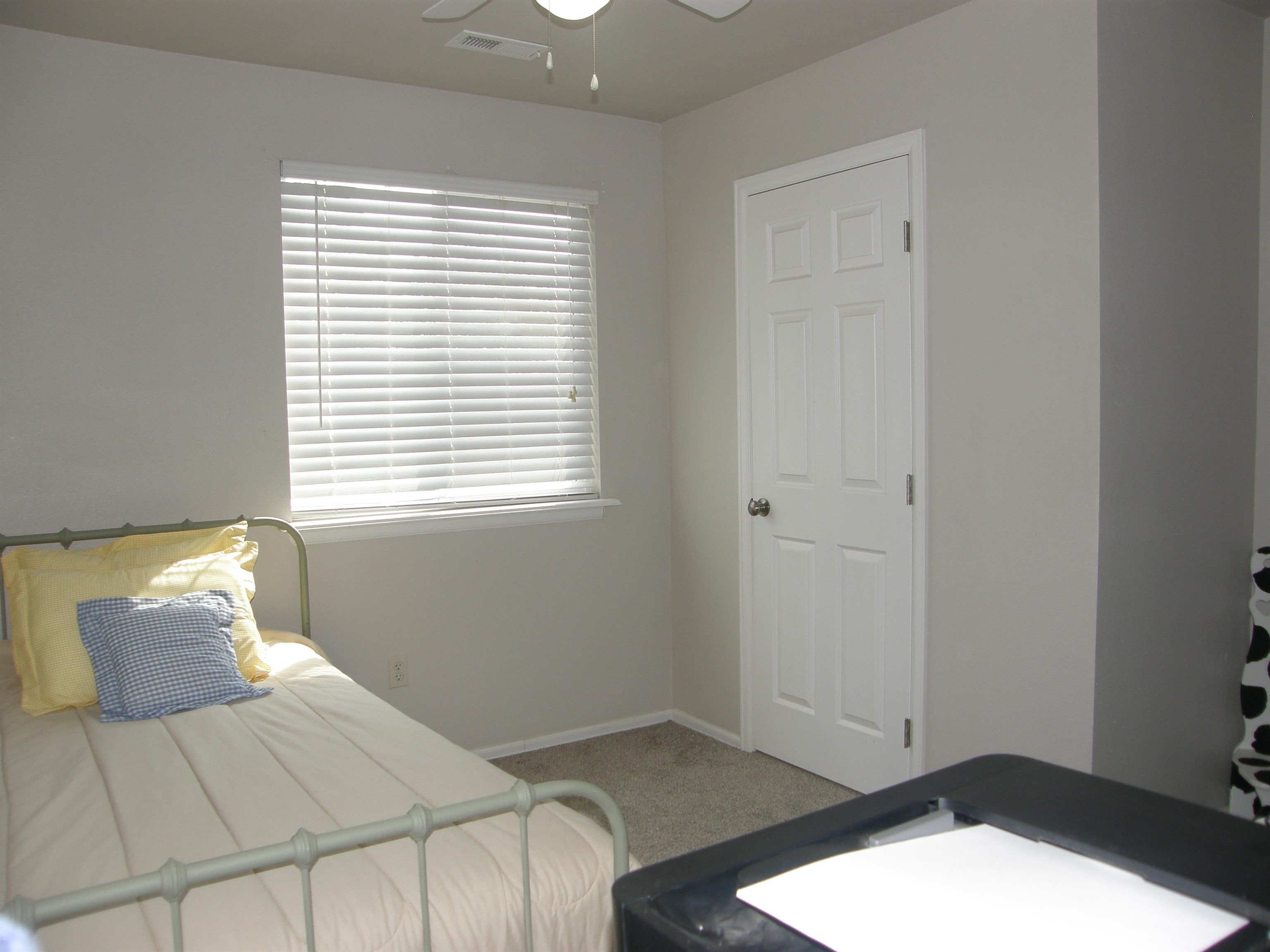 1163 16 Road Fruita, CO 81521 - Photo 27 of 42 a bedroom with a bed and a window