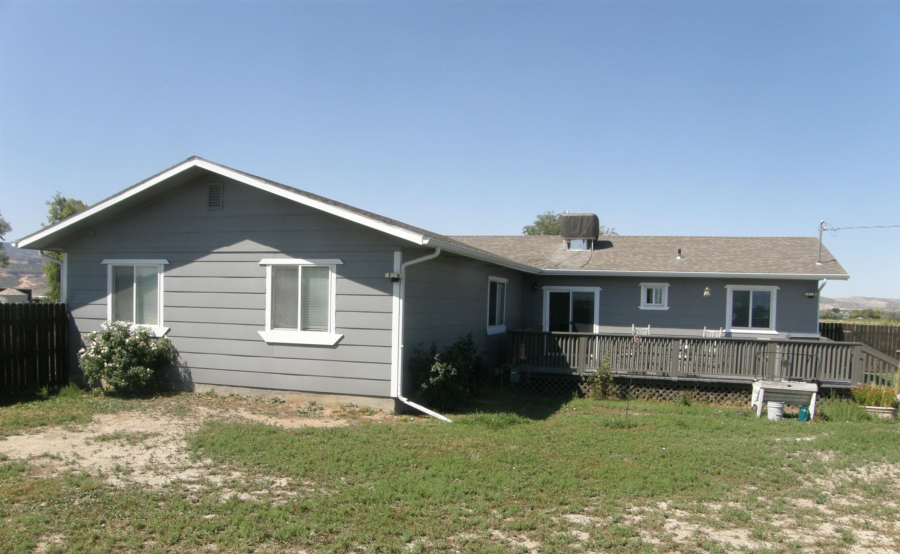 1163 16 Road Fruita, CO 81521 - Photo 3 of 42 a front view of a house with a yard