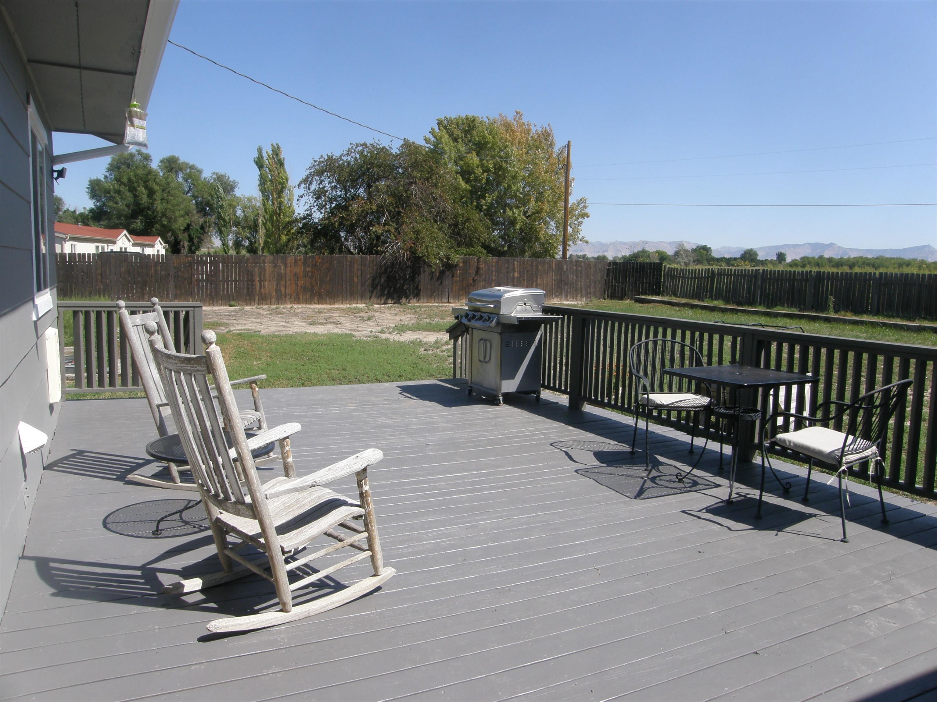 1163 16 Road Fruita, CO 81521 - Photo 8 of 42 a view of a patio with two chairs and a table