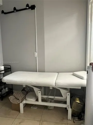 a view of a living room and floor to ceiling window