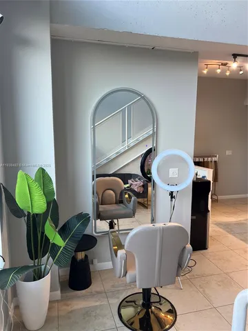 a kitchen with a refrigerator and a stove