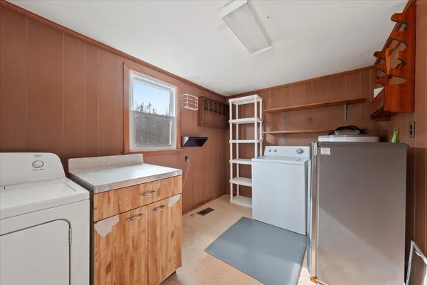 a utility room with dryer and washer