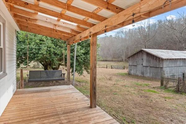 a porch with view of a yard