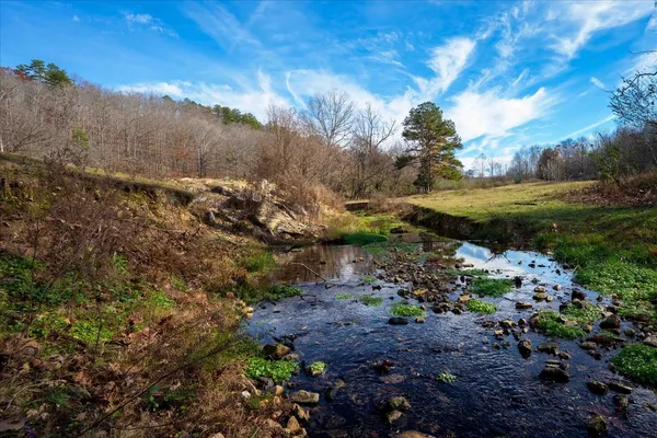 a view of a lake with mountain