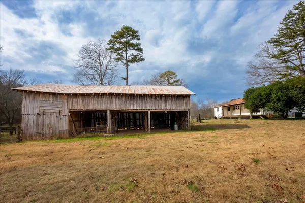 a view of a house with a yard and garage