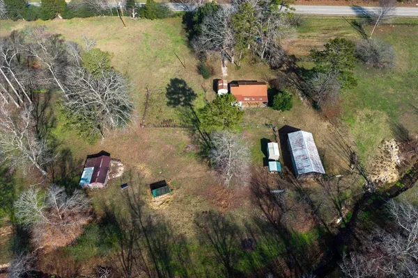 a aerial view of a house with a yard