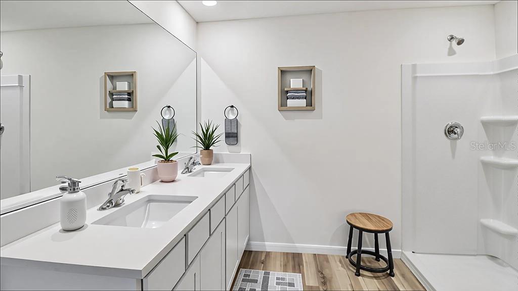 10780 Tucker Road Weeki Wachee, FL 34613 - Photo 6 of 12 a bathroom with a sink a toilet and mirror