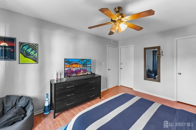 a bedroom with a bed and a bookshelf