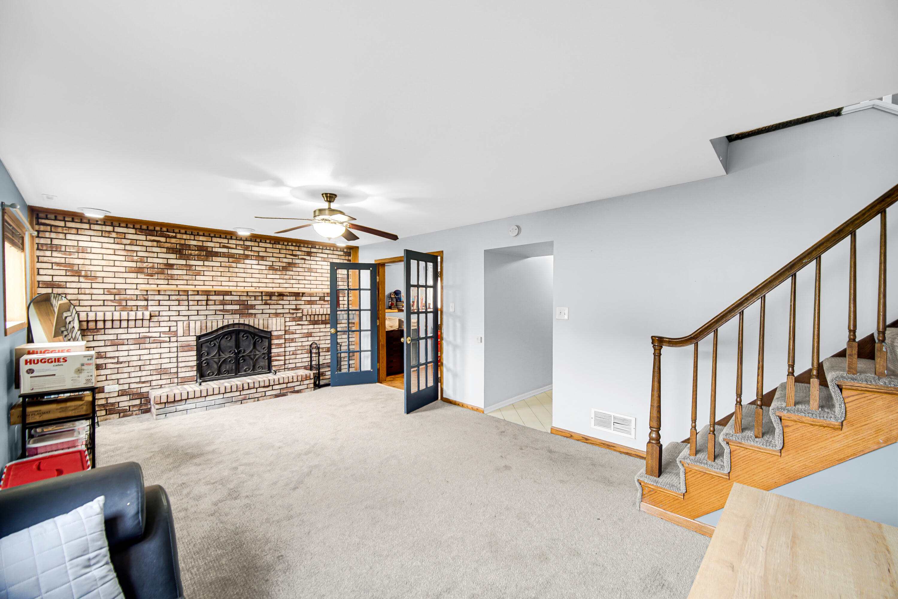 9017 Mathews Street Crown Point, IN 46307 - Photo 11 of 20 a view of a livingroom with an empty space and a fireplace