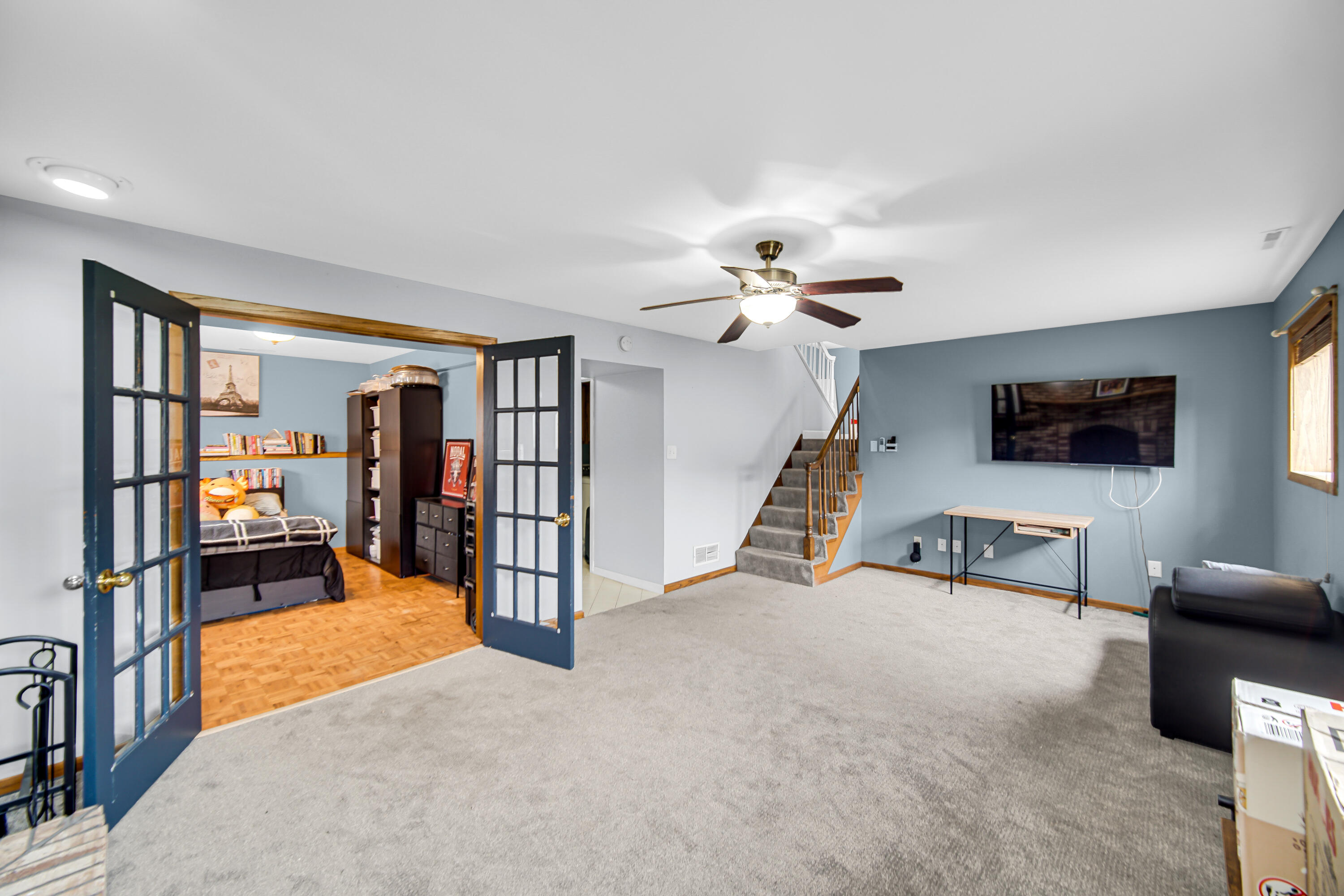 9017 Mathews Street Crown Point, IN 46307 - Photo 12 of 20 a view of a livingroom with furniture and a flat screen tv