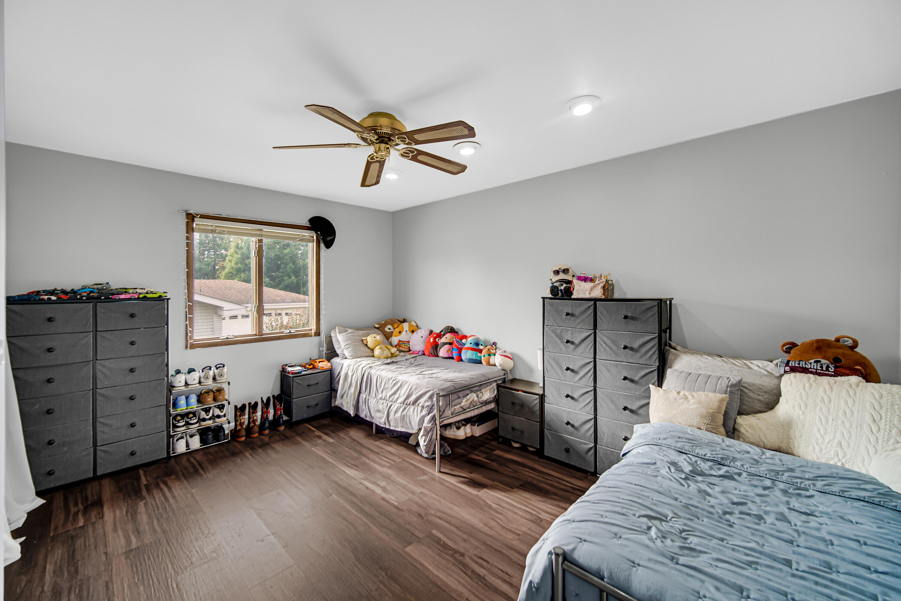 9017 Mathews Street Crown Point, IN 46307 - Photo 14 of 20 a bedroom with a bed and a chandelier