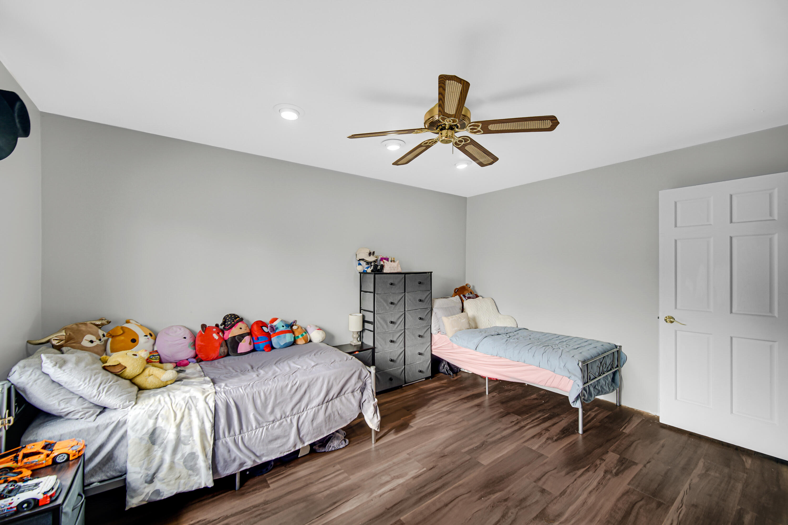 9017 Mathews Street Crown Point, IN 46307 - Photo 15 of 20 a bedroom with two beds and a chandelier