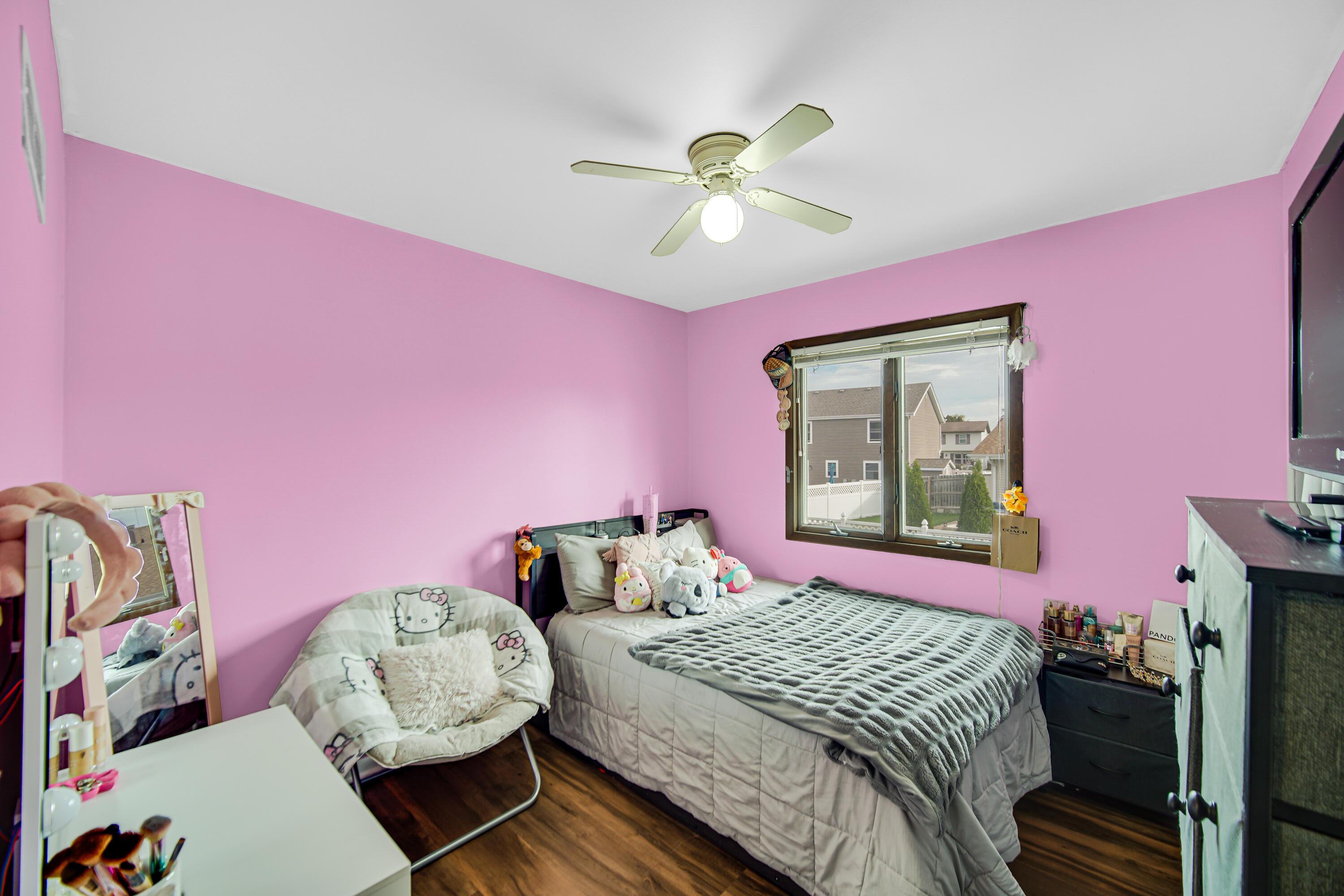9017 Mathews Street Crown Point, IN 46307 - Photo 16 of 20 a bedroom with a bed and a chandelier