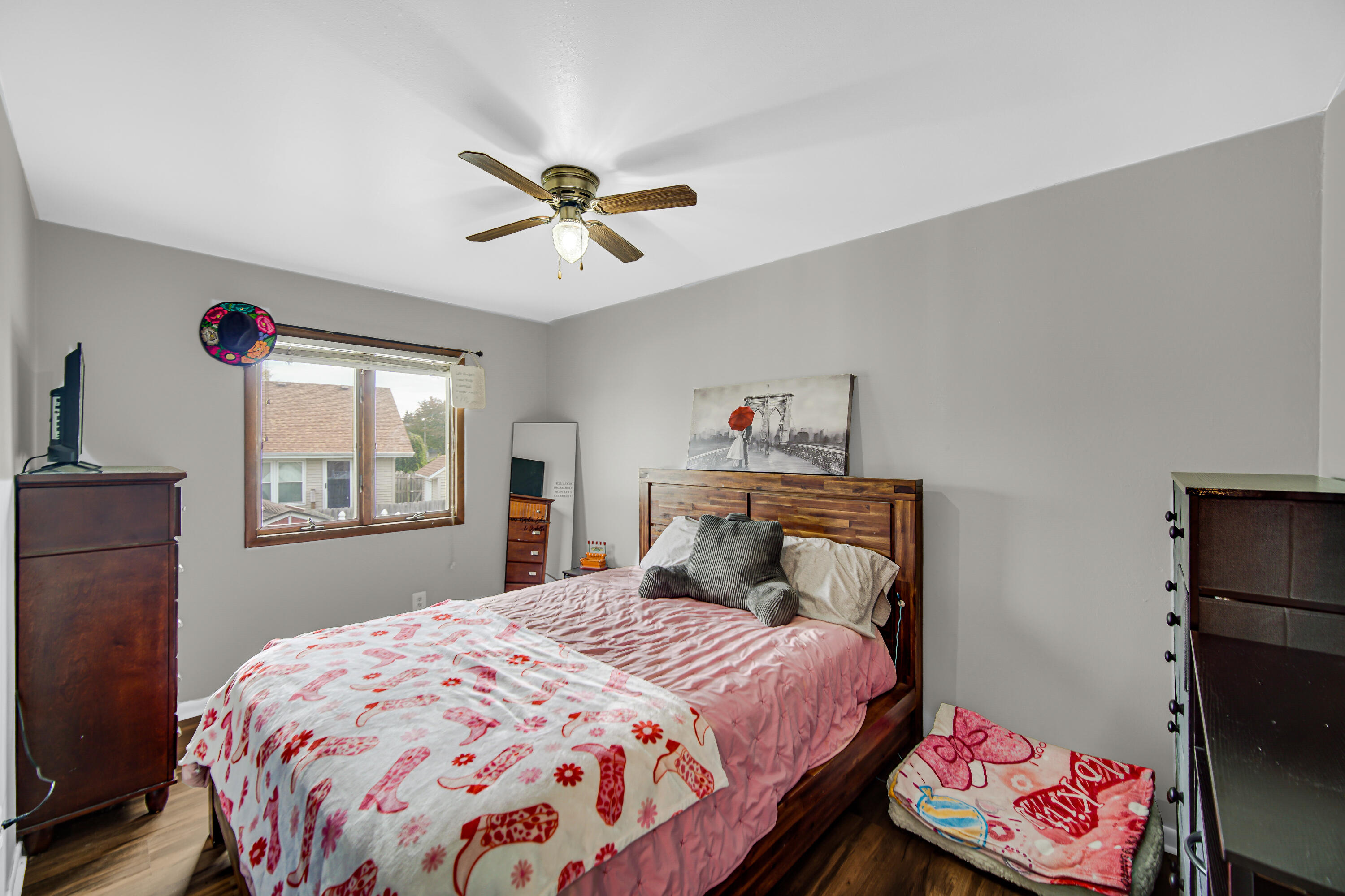 9017 Mathews Street Crown Point, IN 46307 - Photo 17 of 20 a bedroom with a bed and a chandelier