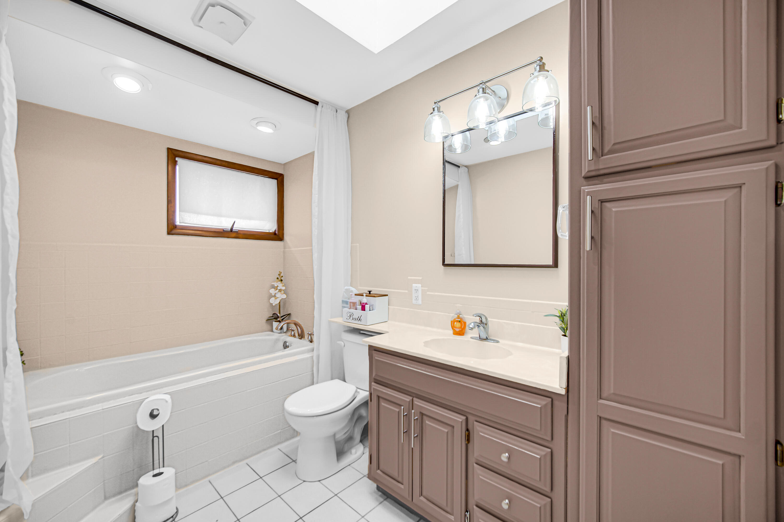 9017 Mathews Street Crown Point, IN 46307 - Photo 18 of 20 a bathroom with a toilet sink and mirror