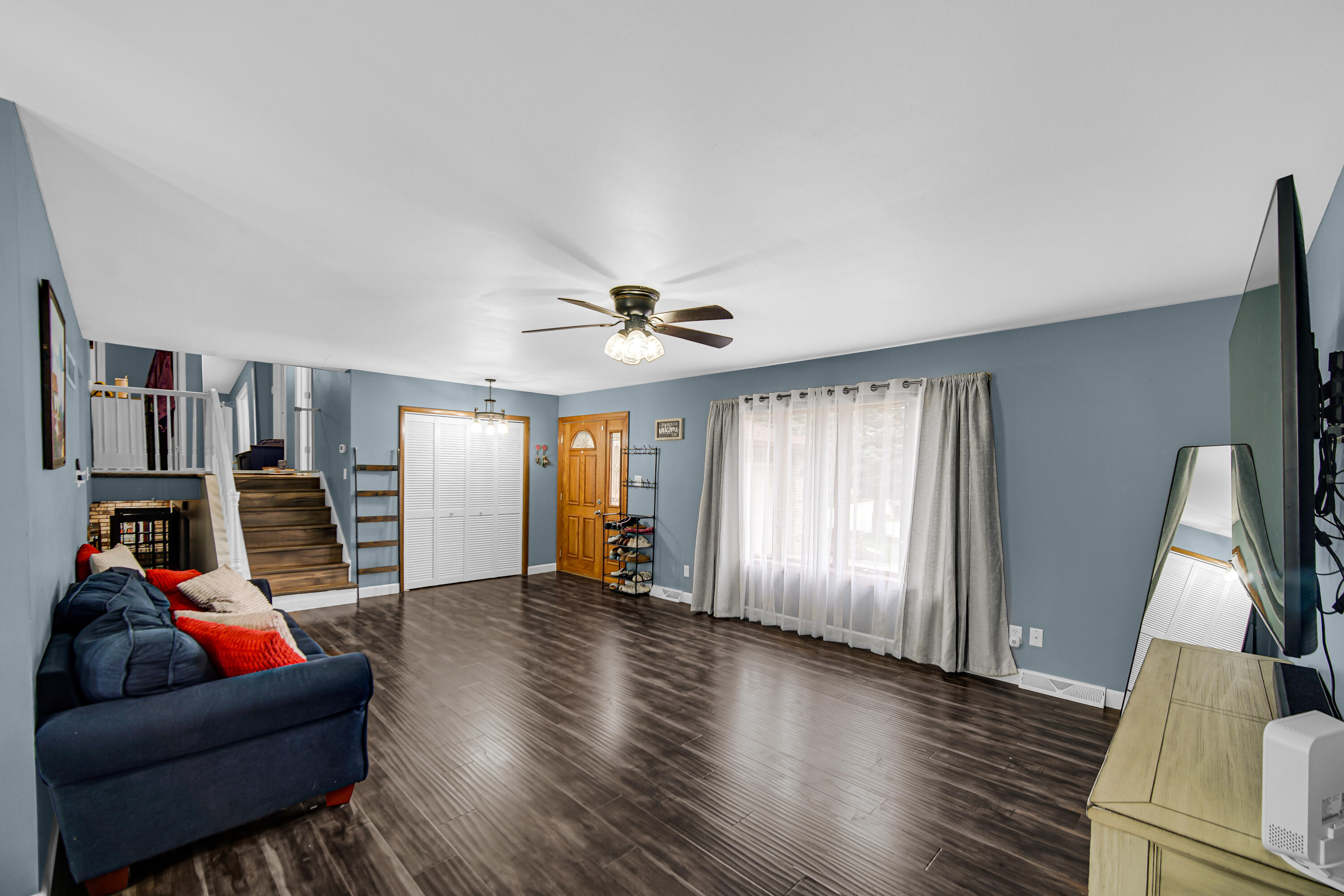 9017 Mathews Street Crown Point, IN 46307 - Photo 5 of 20 a living room with furniture and a flat screen tv