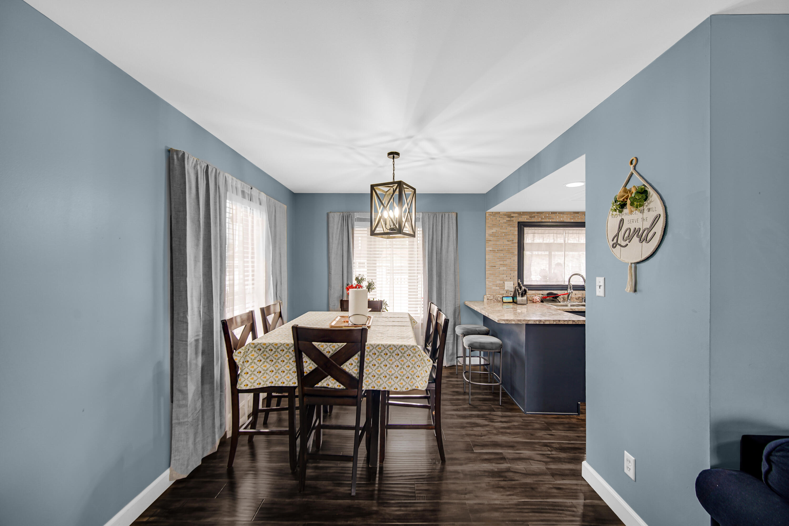 9017 Mathews Street Crown Point, IN 46307 - Photo 6 of 20 a view of a dining room with furniture window and wooden floor