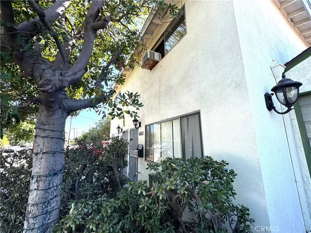 a large kitchen with a sink and washing machine