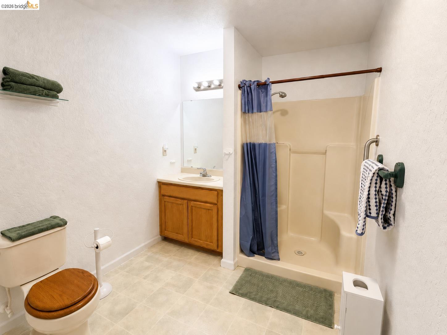 18195 Wards Ferry Road Sonora, CA 95370 - Photo 23 of 67 Three-piece bath with a walk-in shower, single vanity, and tile flooring