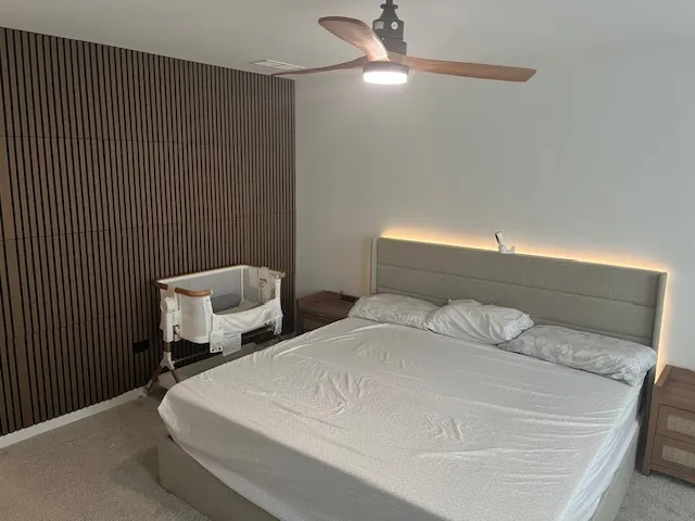 a bedroom with bed and window