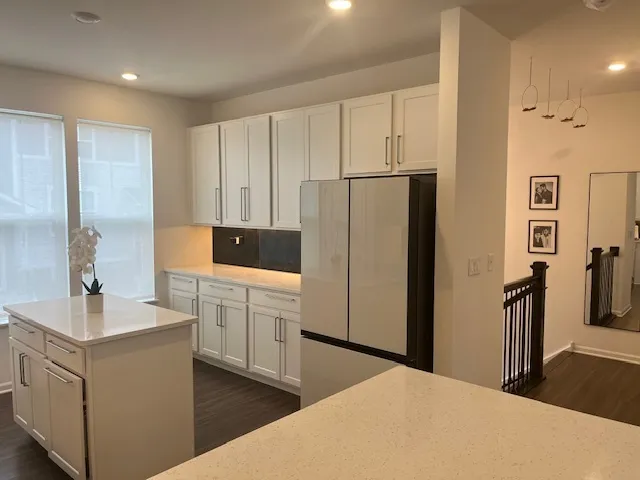 a kitchen with a refrigerator stove and sink