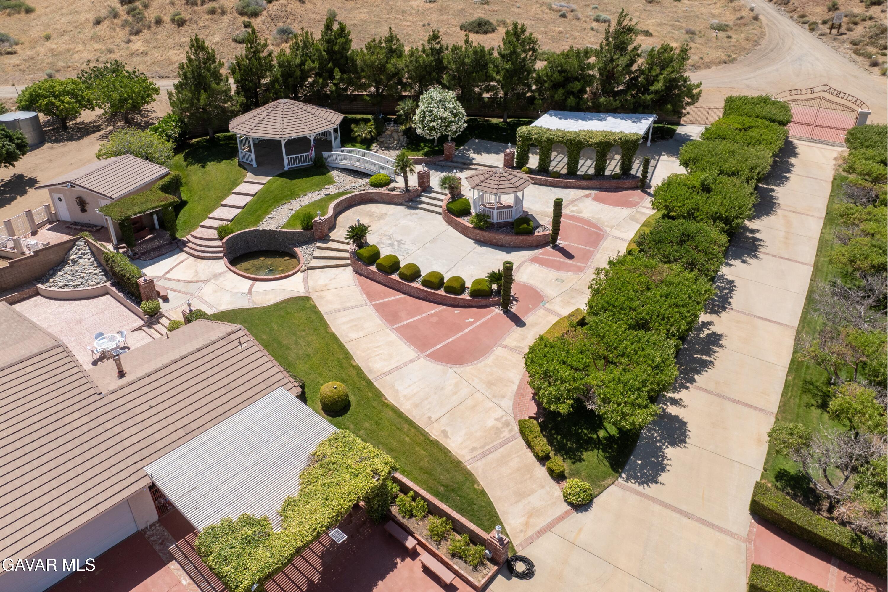 5801 Hacienda Ranch Road Palmdale, CA 93551 - Photo 42 of 69 an aerial view of a house with garden