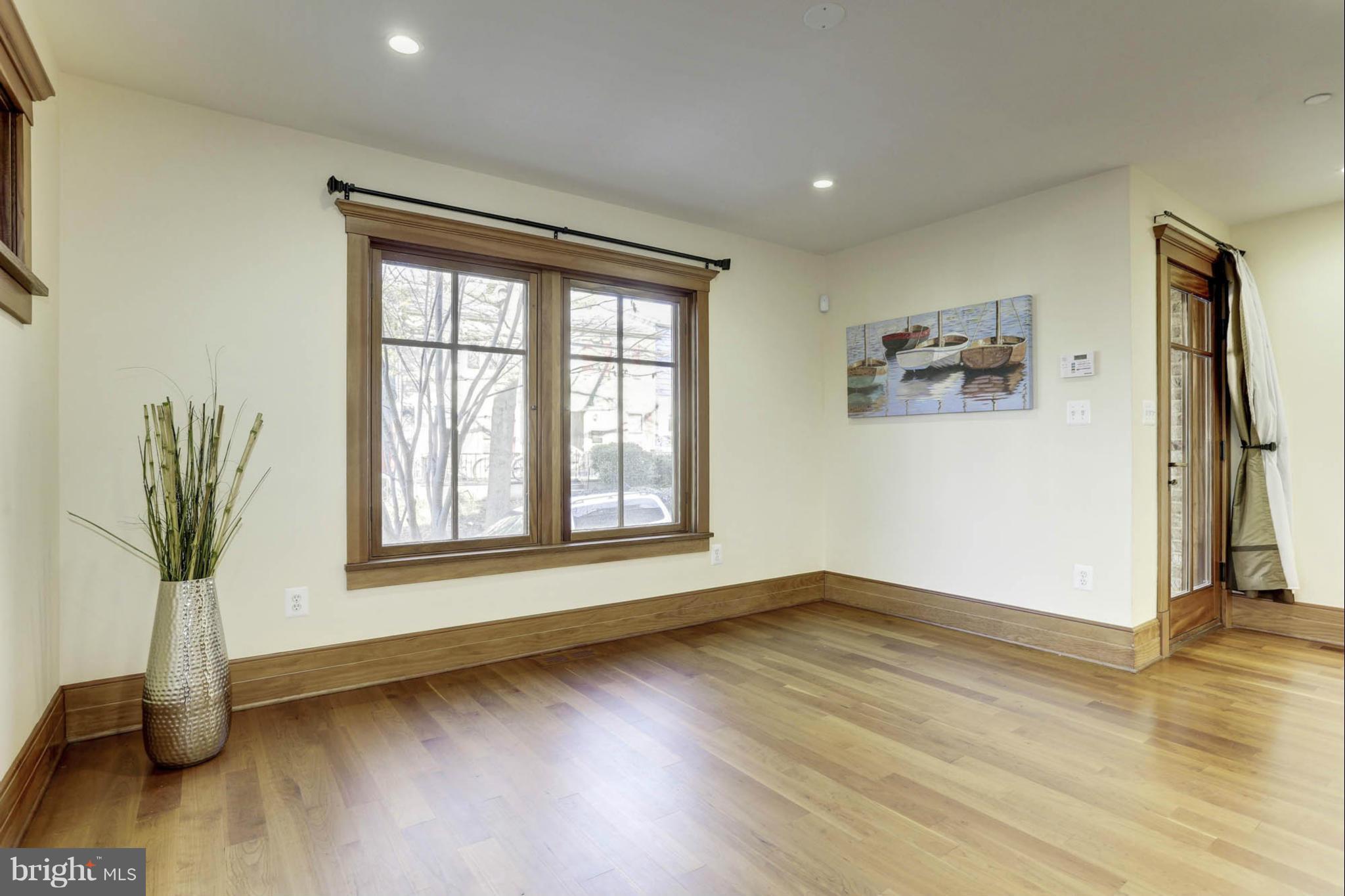 24 Dean Street Annapolis, MD 21401 - Photo 11 of 30 a view of an empty room with wooden floor and a window