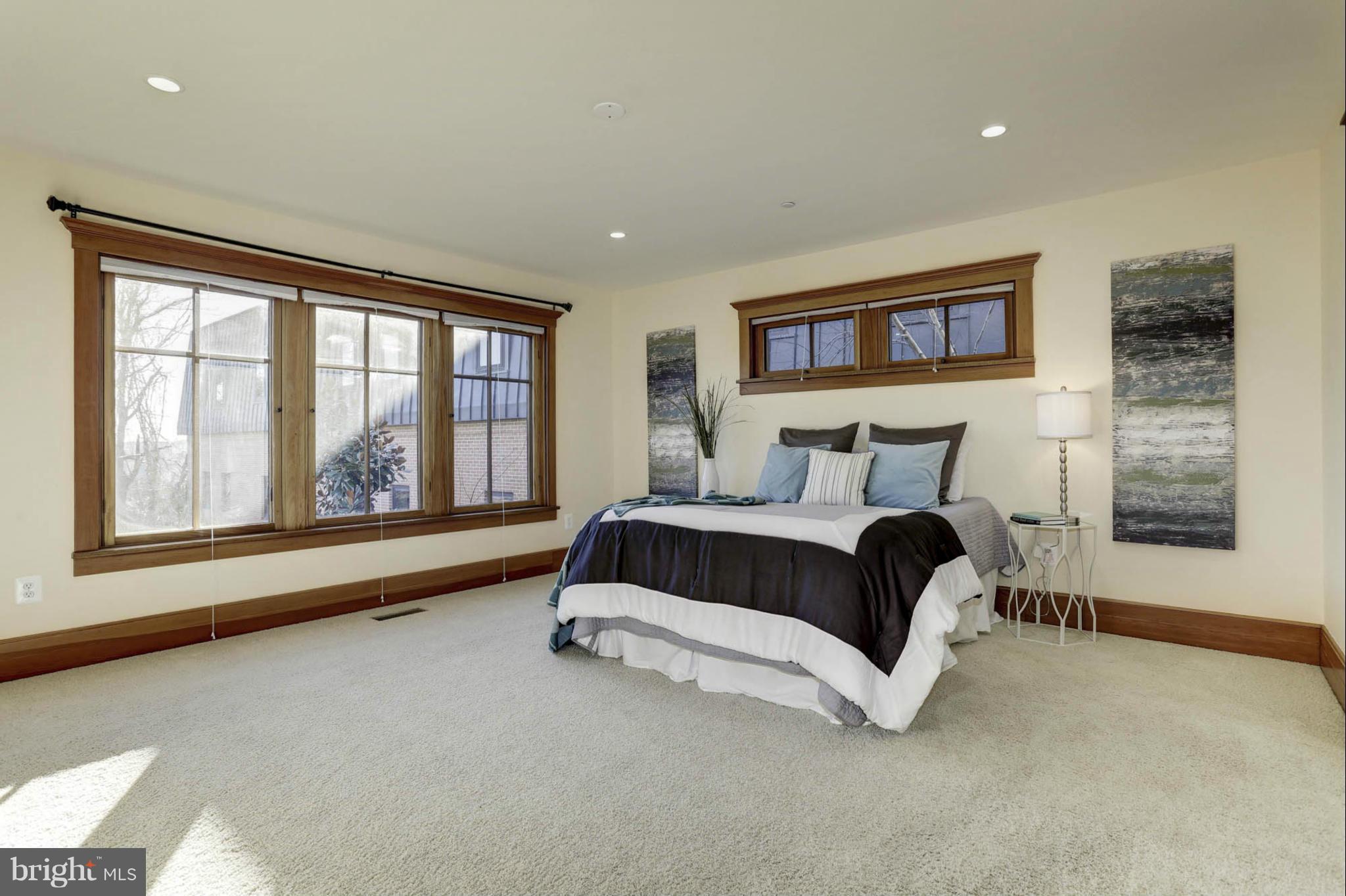 24 Dean Street Annapolis, MD 21401 - Photo 13 of 30 a bedroom with a bed and a large window