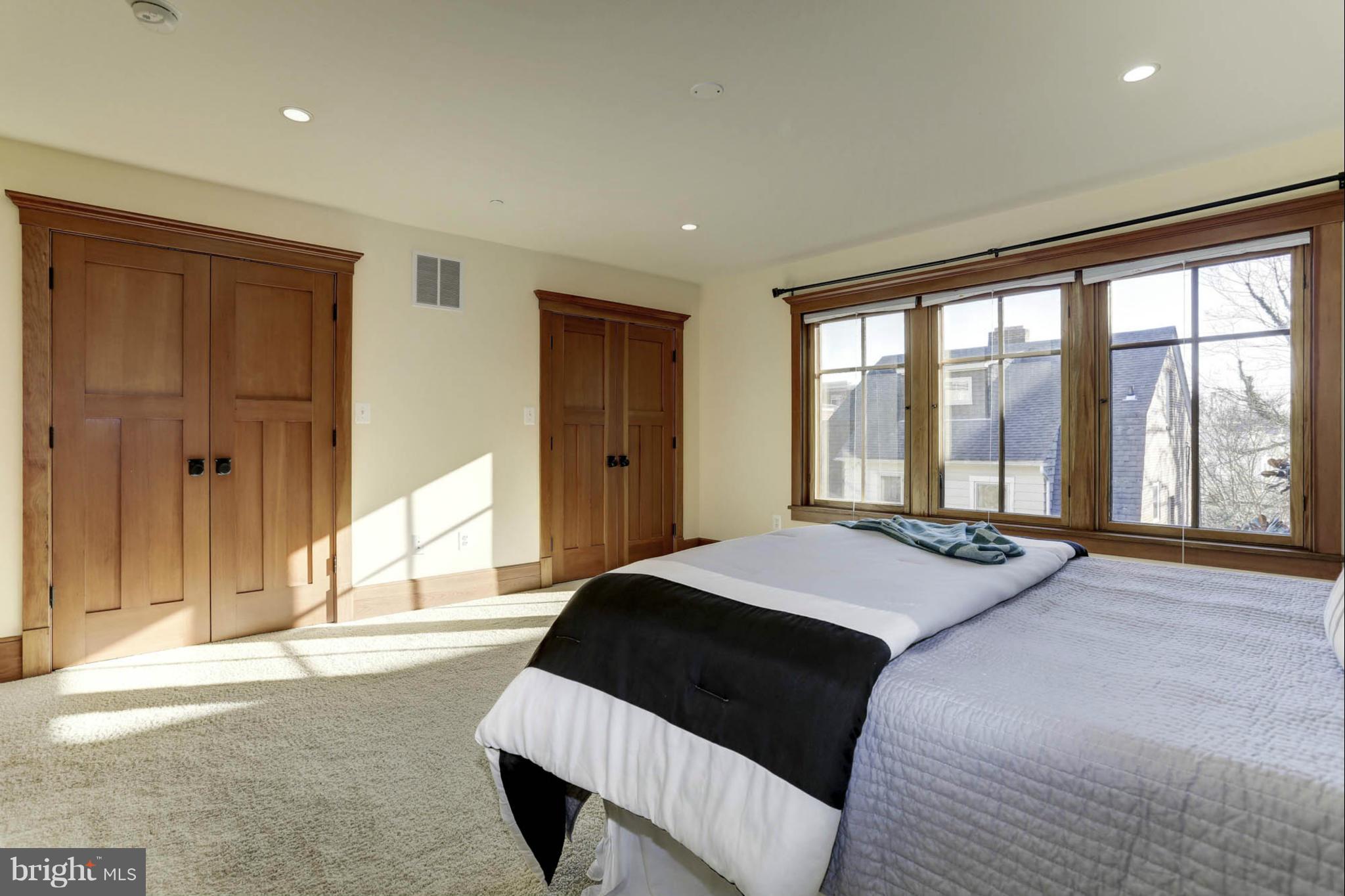 24 Dean Street Annapolis, MD 21401 - Photo 15 of 30 a spacious bedroom with a large bed and a large window