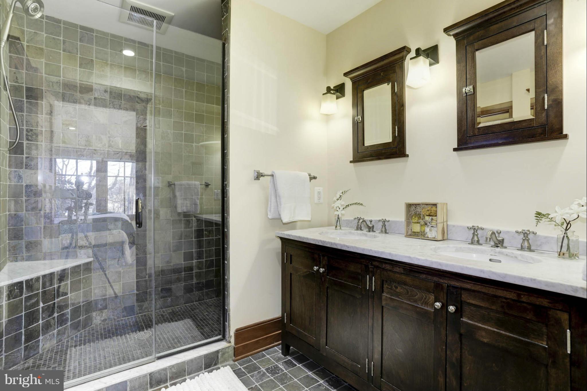 24 Dean Street Annapolis, MD 21401 - Photo 16 of 30 a bathroom with a double vanity sink mirror and shower